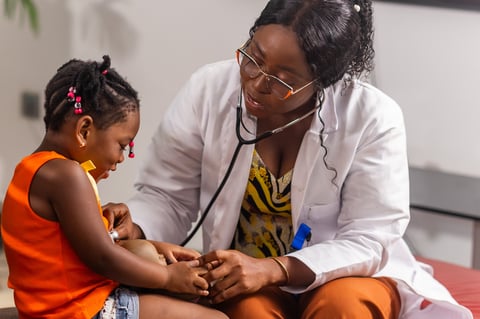 Pediatric doctor with child patient